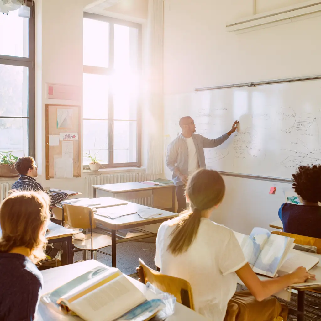 teacher at whiteboard in classroom bradenton
