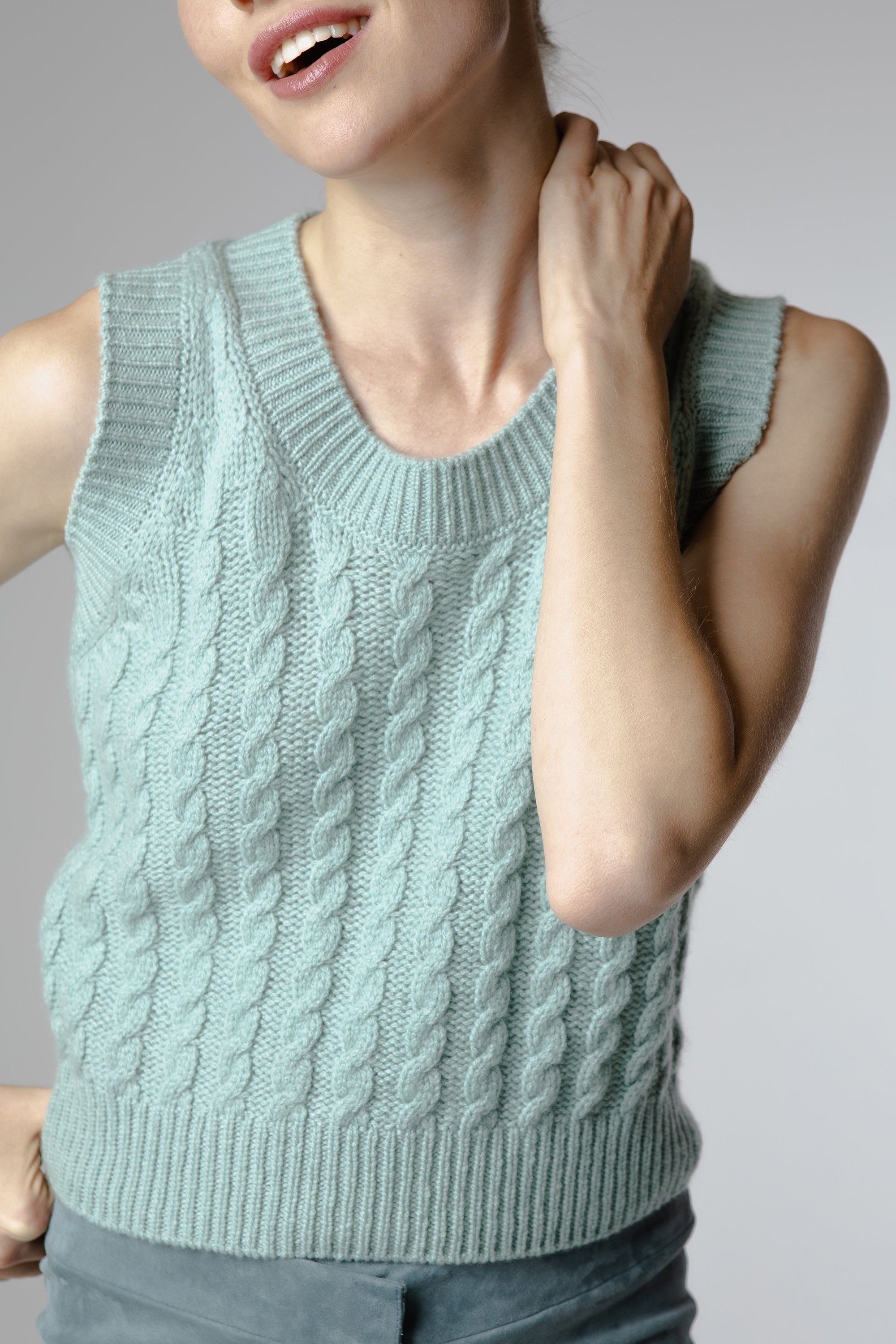 Close-up of Bella Cashmere Top Dew showing premium Italian cashmere texture and intricate cable detailing.