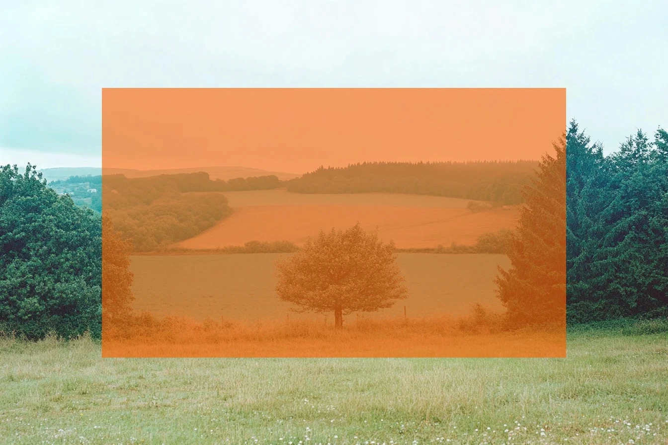 A landscape photograph overlaid with a large, semi-transparent orange rectangle, highlighting a section of rolling hills and trees. The contrast between natural and digital elements adds an abstract visual layer, representing strategy prototyping and the integration of innovative approaches within planetary perspectives