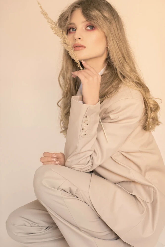 Beige suit, seated pose