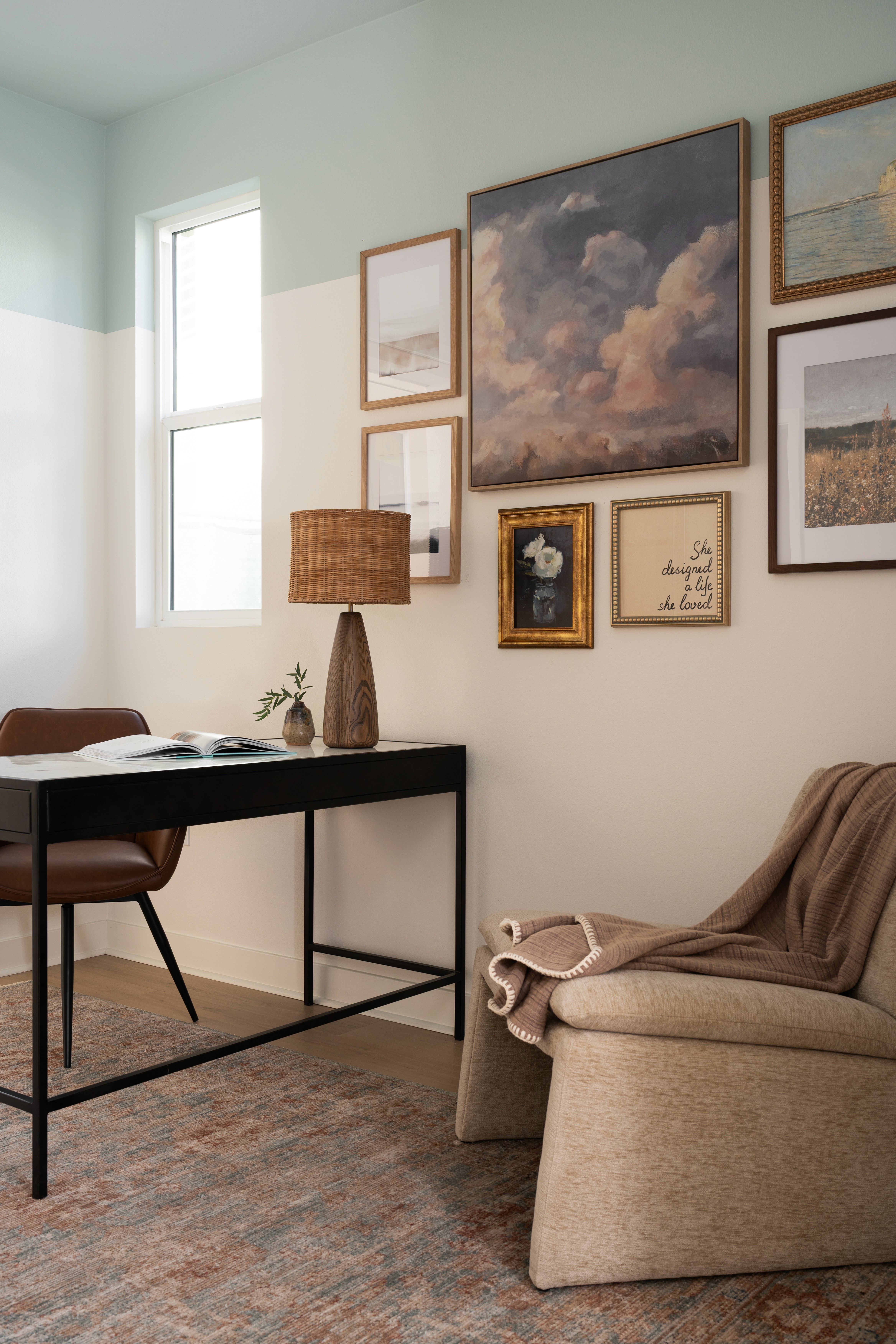 Office gallery wall with chair, desk, lamp and decor