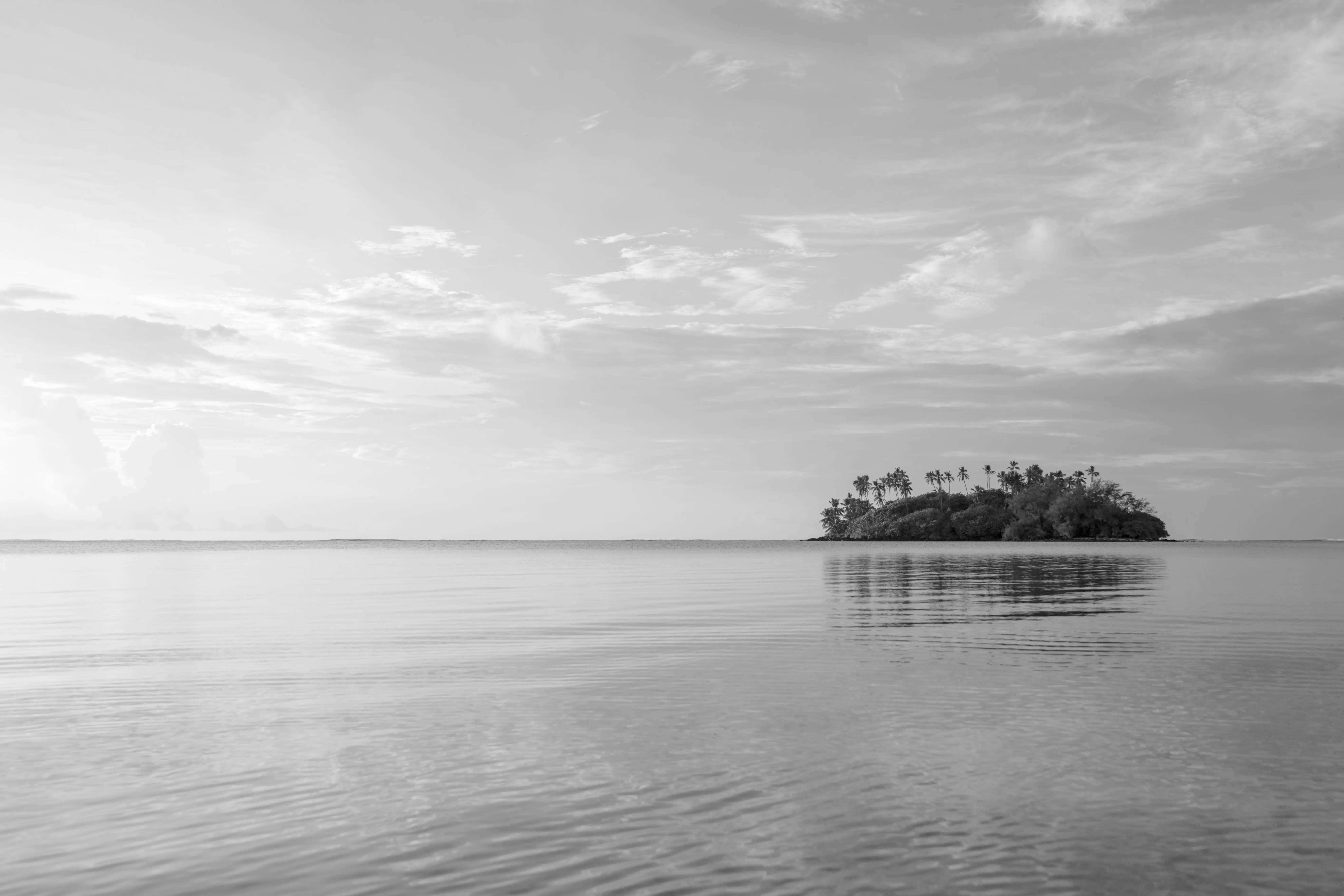 Aitutaki lagoon in the Cook Islands at sunset, South Pacific island destination accessible by private jet charter