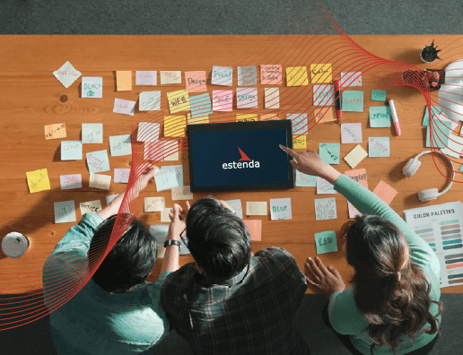 MacBook beside iPhone X on brown table