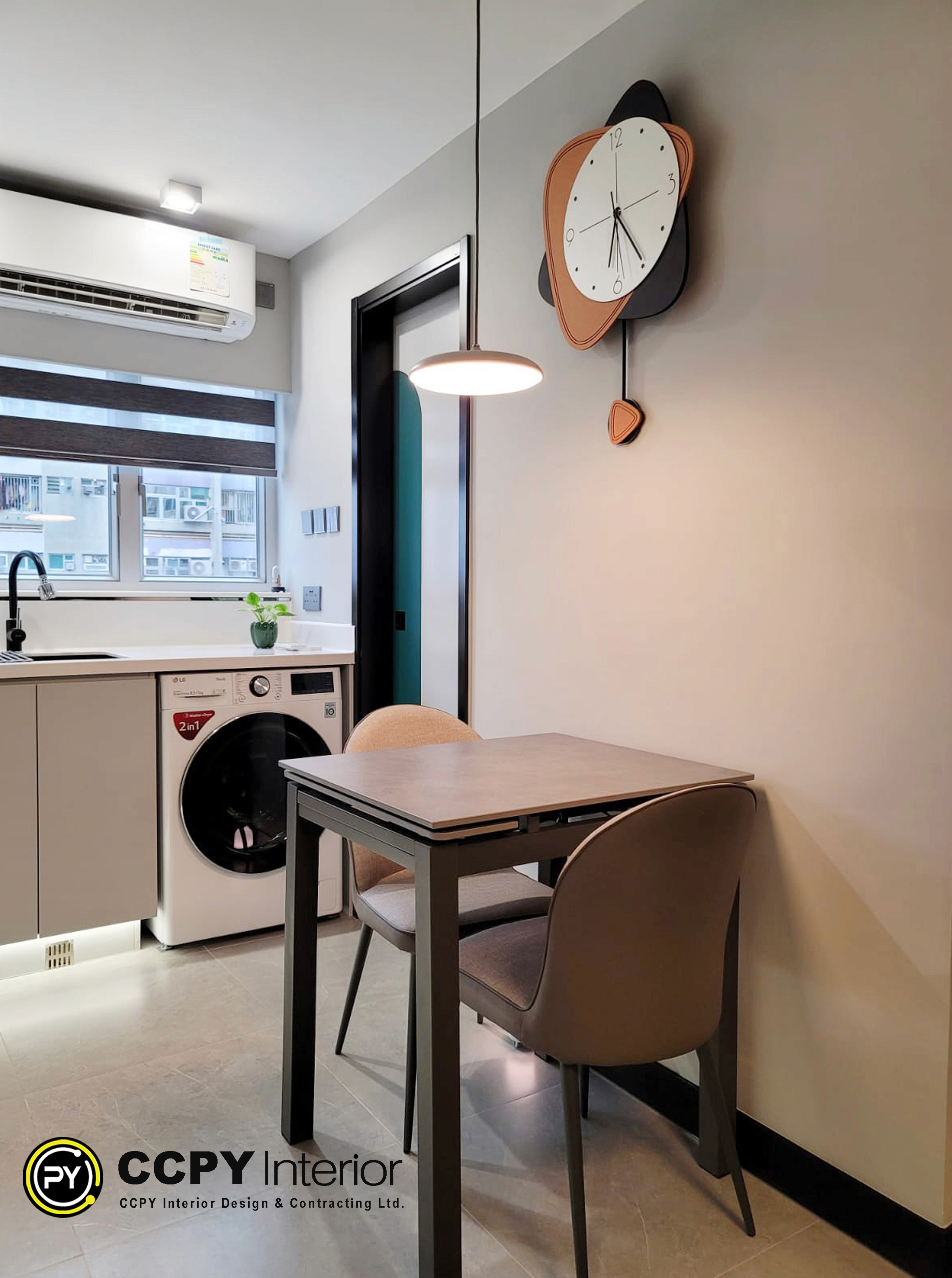 Interior Design BreakdownThe selected region showcases a modern, space-optimized kitchen and dining area designed for compact urban living.Key Design FeaturesSpace Optimization: A front-loading washing machine is seamlessly integrated directly under the kitchen countertop to maximize floor space.Color Palette: The area utilizes a neutral blend of warm wood tones on the dining table, clean white cabinetry, and contrasting matte black fixtures.Lighting & Layout: A large window brings in natural light, regulated by a modern zebra roller blind, while a minimalist pendant light hangs over the seating area.Project ContextBased on the accompanying project details in the image, this interior renovation features the following specifications:Location: Pok Hong Estate, 6 Sha Kok Street, Shatin, N.T., Hong KongSize: 455 Square FeetTotal Cost: HKD 680,000Layout: 2 Bedrooms, 1 Bathroom