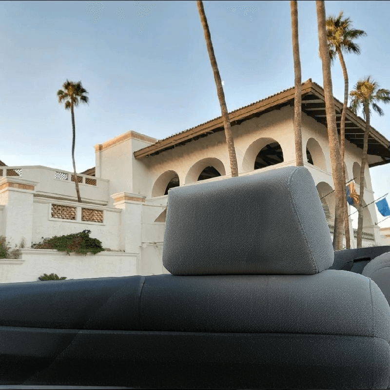 a large building sitting next to a body of water