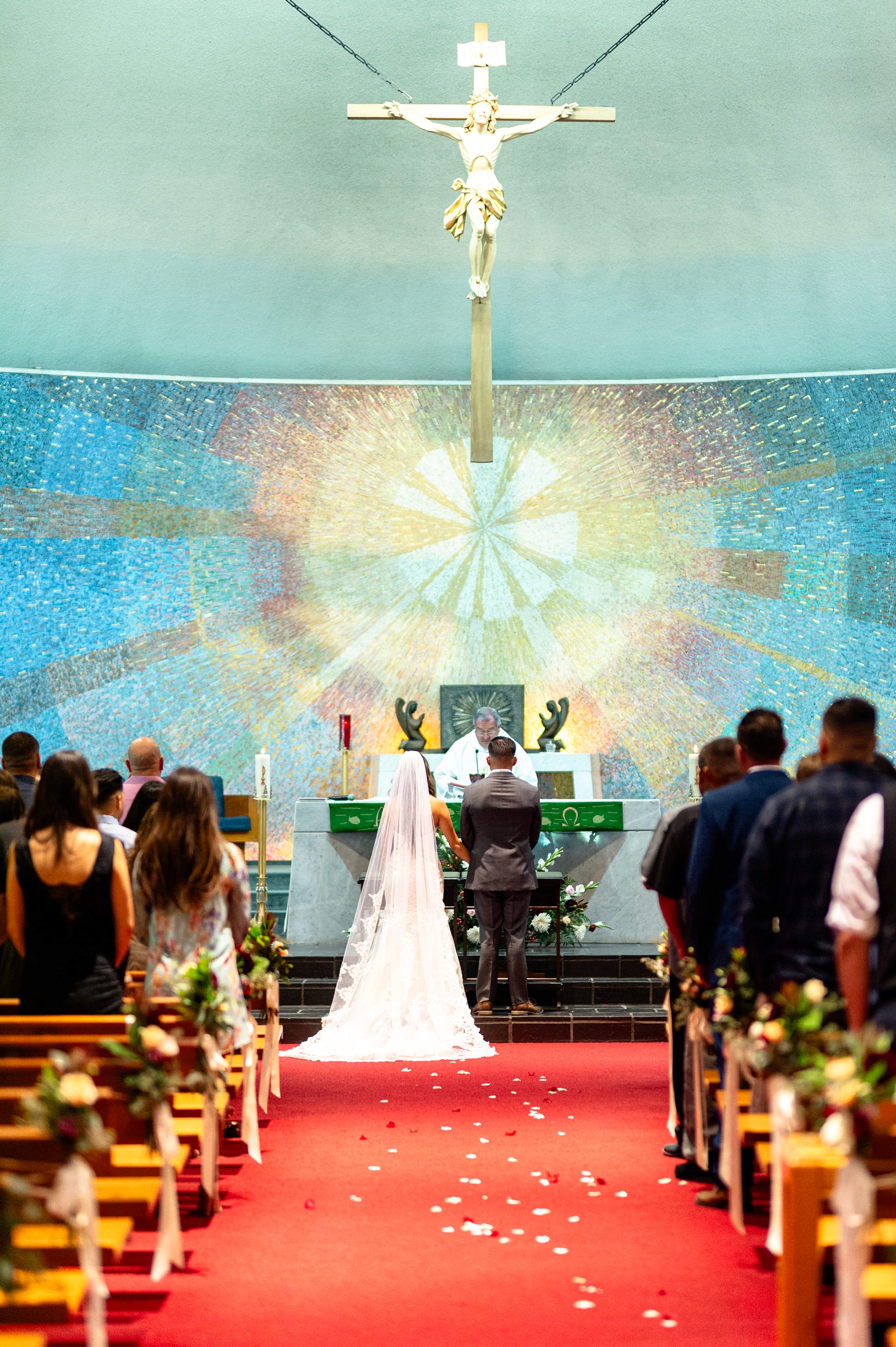 Flat lay wedding details with bouquet, rings, and sparkling bridal heels
