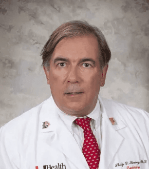 Phil harvey md in a medical coat with a red tie