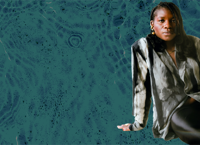 Blue-green water background with Dali sitting in the foreground in a gradient black and white button down shirt and black pants, sitting on the side and legs parallel facing the right
