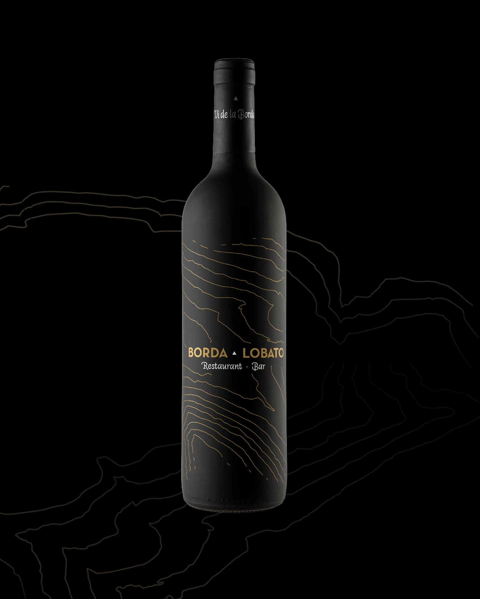 Black wine bottle with the Borda Lobato label, brand identity design by Sebastian Saavedra