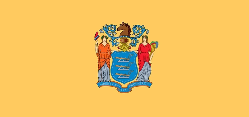 A golden-yellow flag featuring New Jersey's state coat of arms. The emblem has a blue shield with horses, goddesses, and "Liberty and Prosperity 1776."