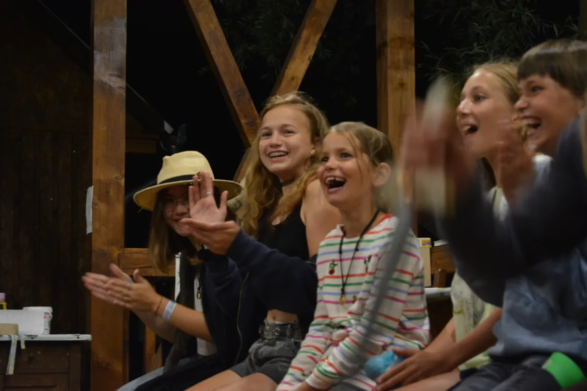 woman walking near plants and tall trees during daytime