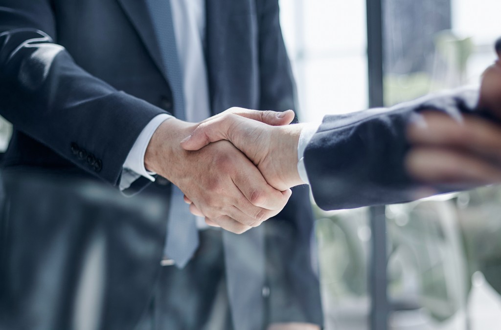 person writing on a piece of paper