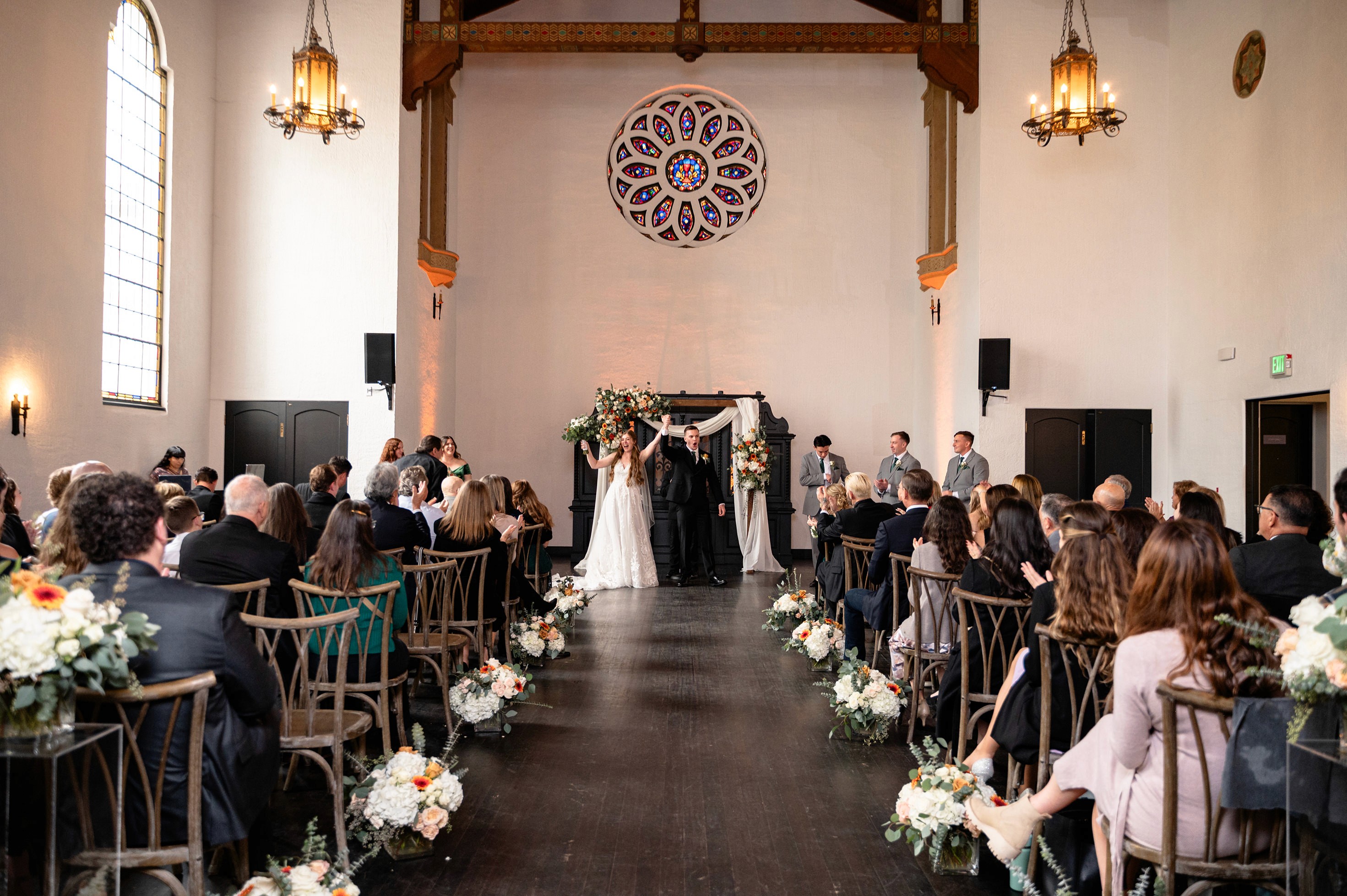 Flat lay wedding details with bouquet, rings, and sparkling bridal heels