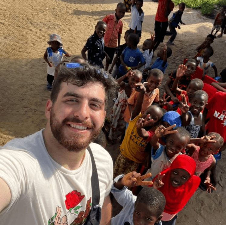 british man in a black striped suit 
