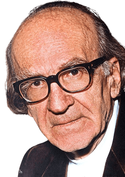 Color portrait of an elderly man with thinning hair, wearing dark-rimmed glasses and a serious expression. He has deep-set eyes, a high forehead, and slight wrinkles, suggesting wisdom and experience. Dressed in a dark jacket over a white shirt, he appears to be in a study or library setting, with bookshelves in the background.