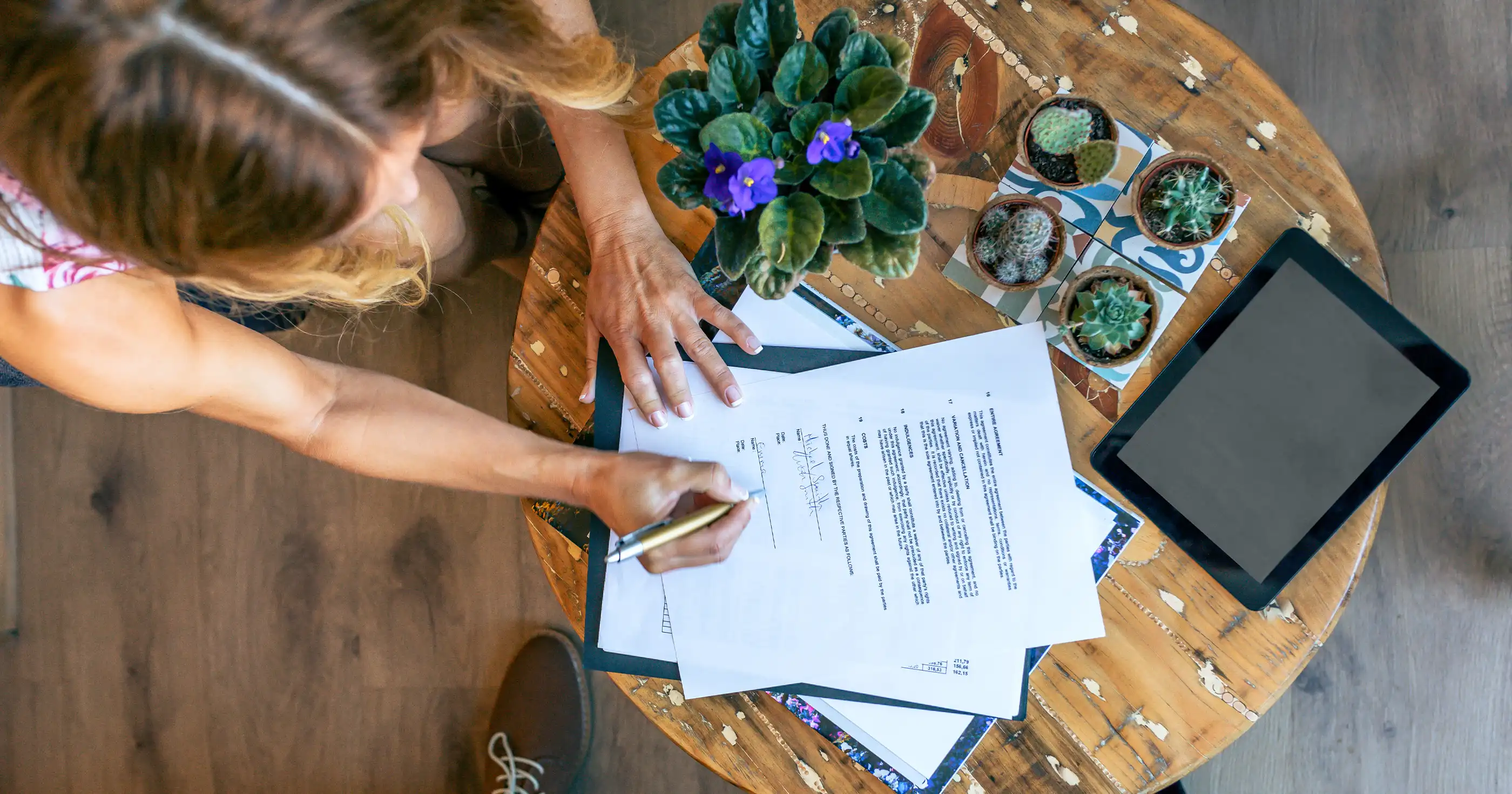 a female songwriter signing a music contract