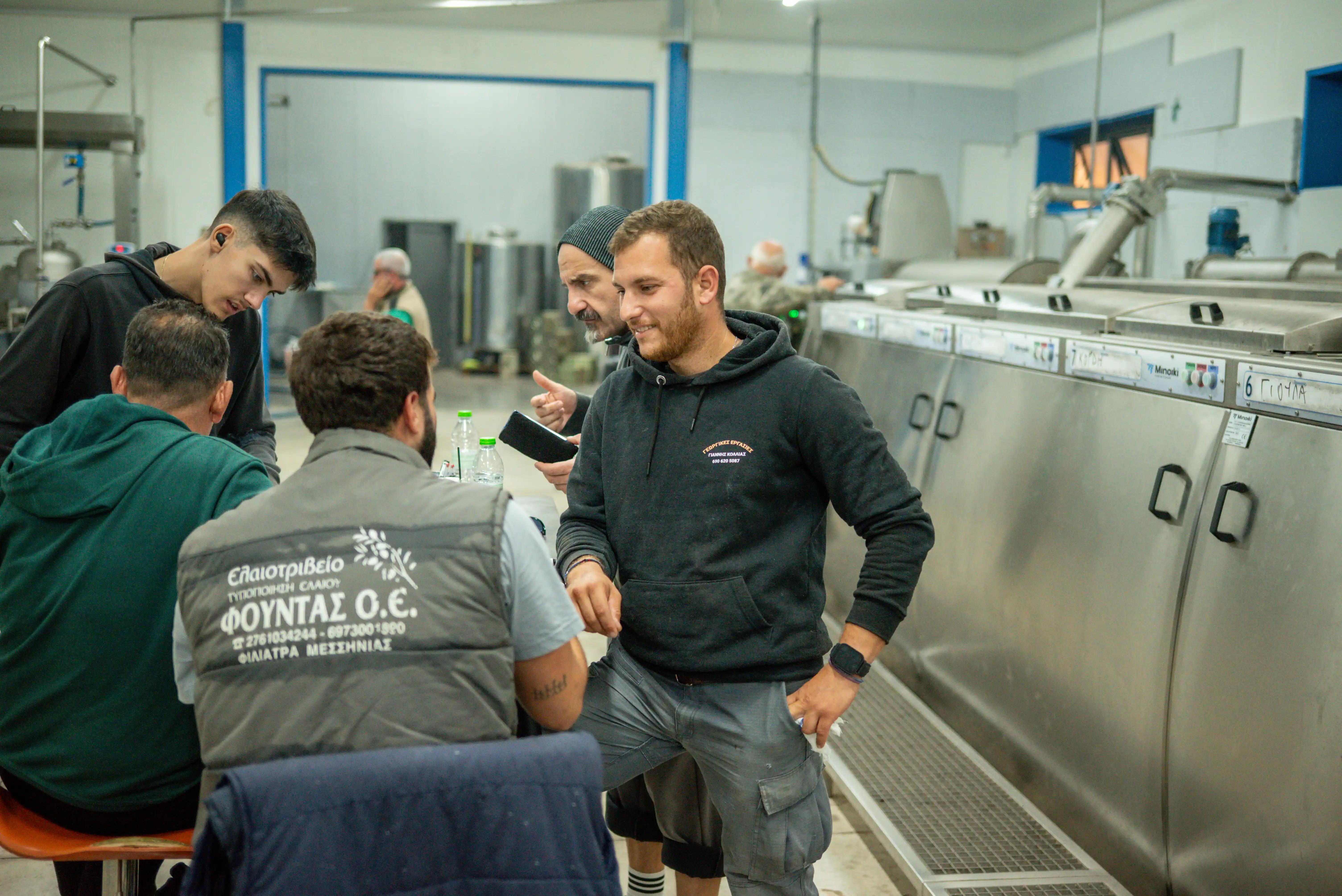 The dedicated professional team at Fountas olive oil mill in Filiatra, Messenia, during the extra virgin olive oil production process.