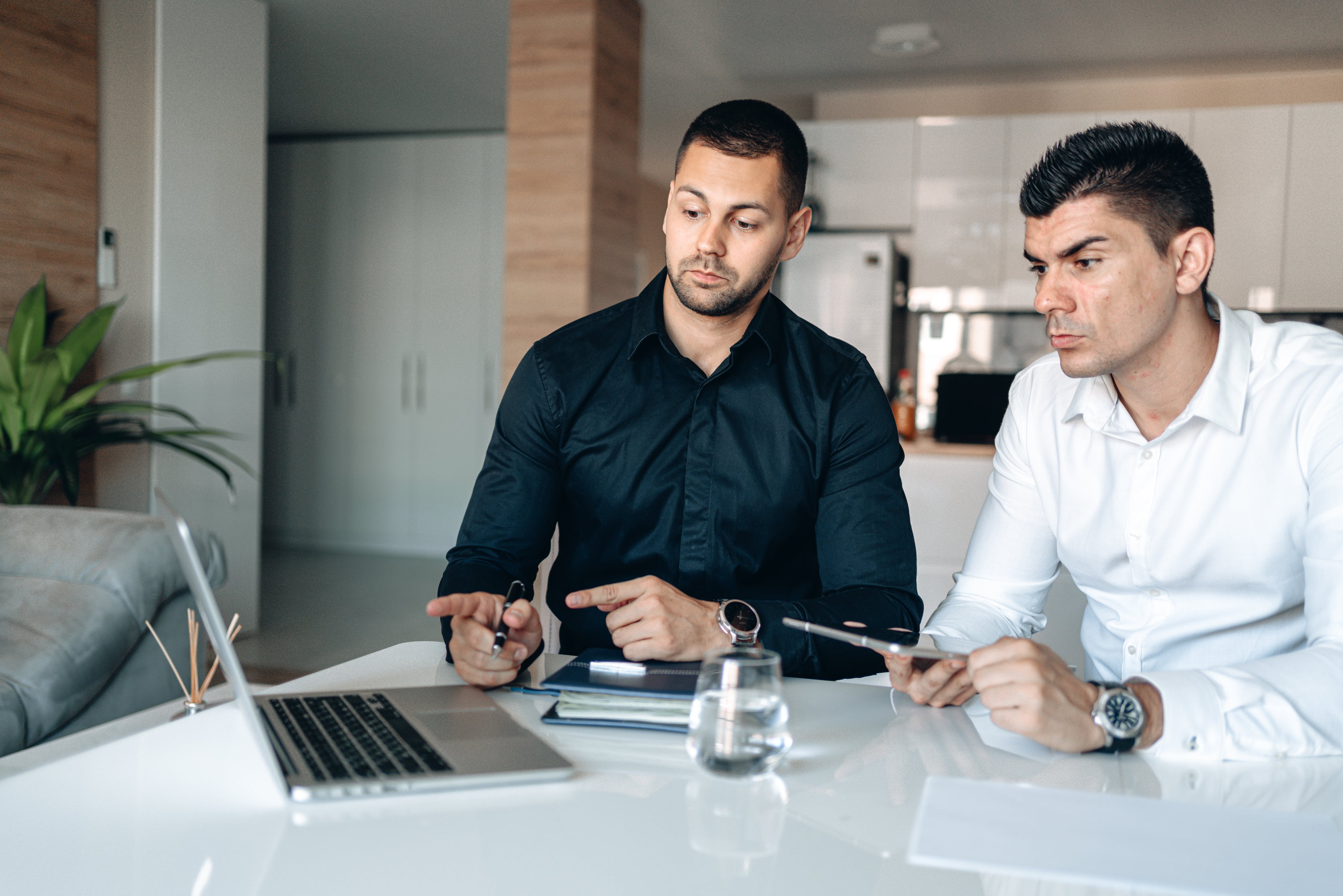 Men in long sleeves discussing how to build a strong client base