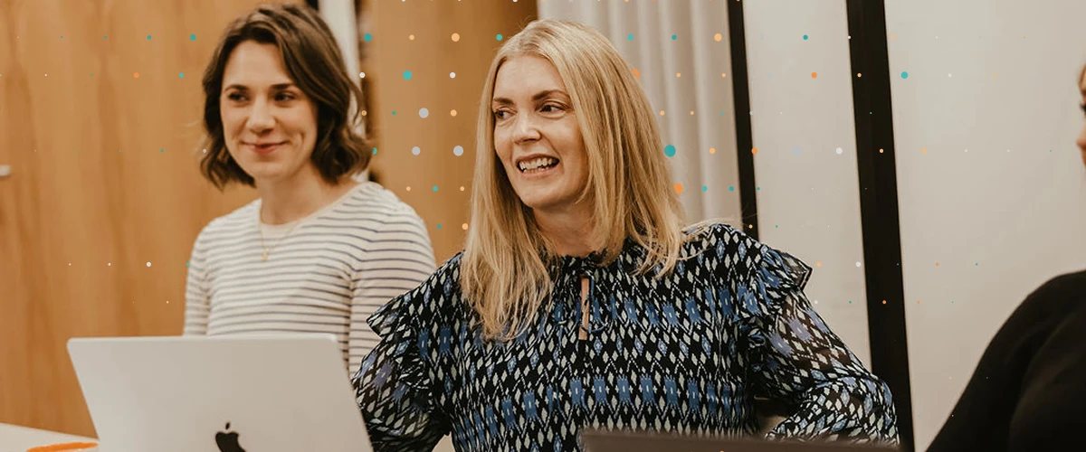 Lean Tree team members sat in a meeitng with a laptop