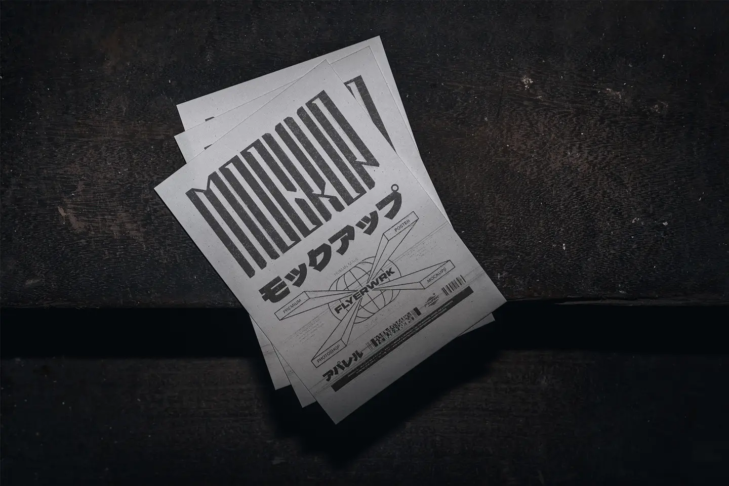 Stacked A5 flyers with brutalist Japanese typography and experimental graphic elements in a dark setting