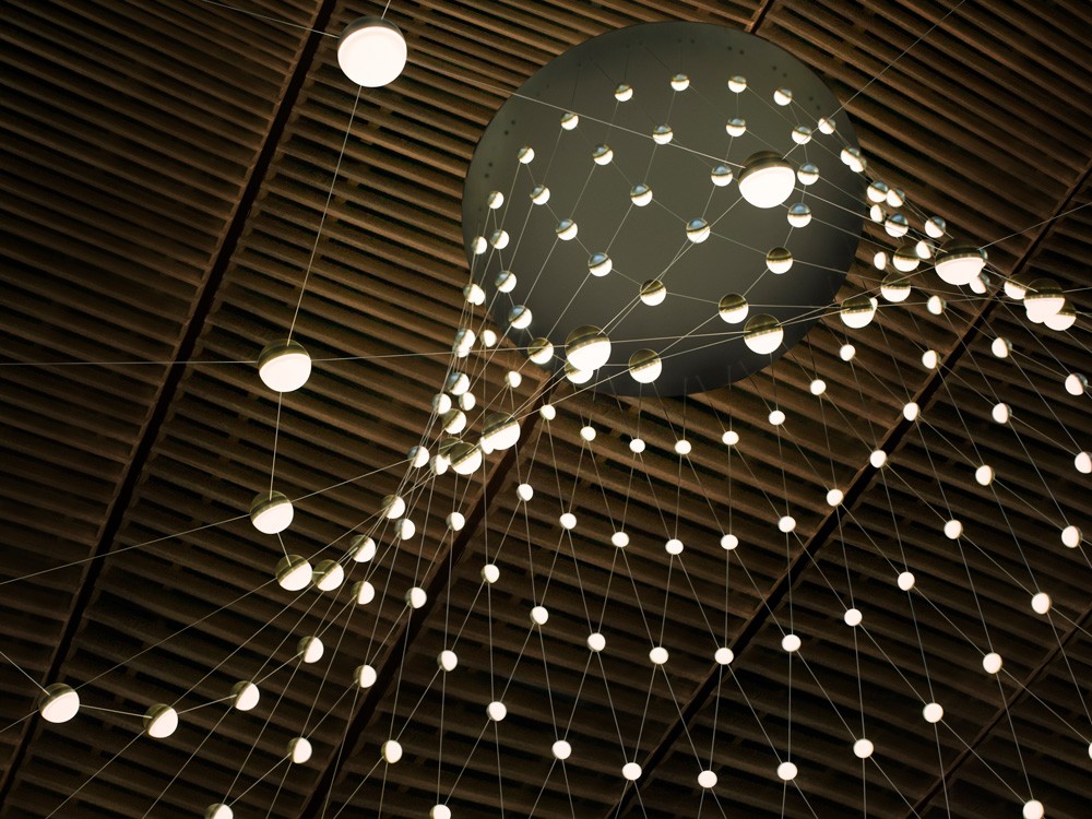 View from beneath the lighting installation at the Botswana Innovation Hub, highlighting the geometric pattern of the illuminated nodes.