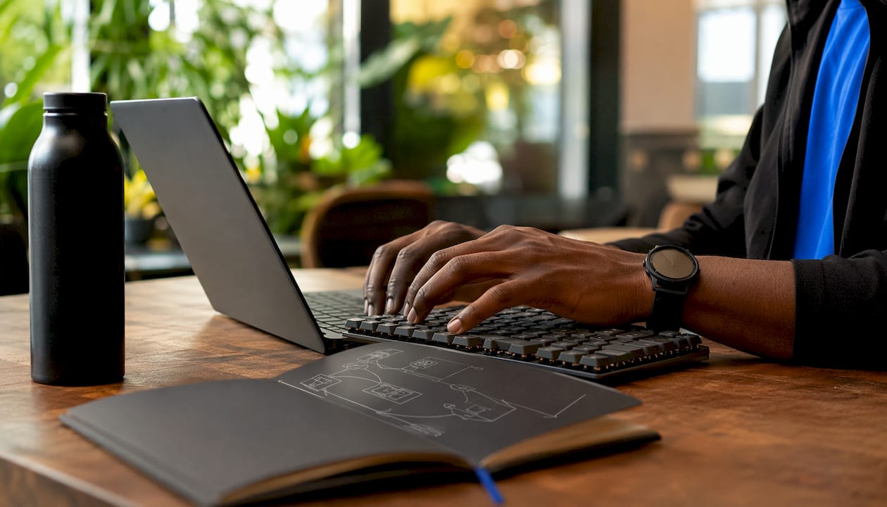 IT engineer typing in data center workspace