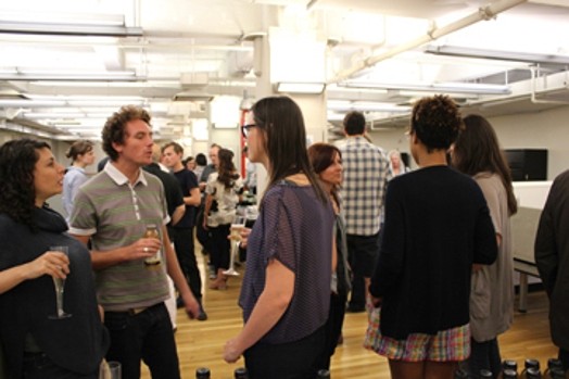 image of people taking to each other in a large room