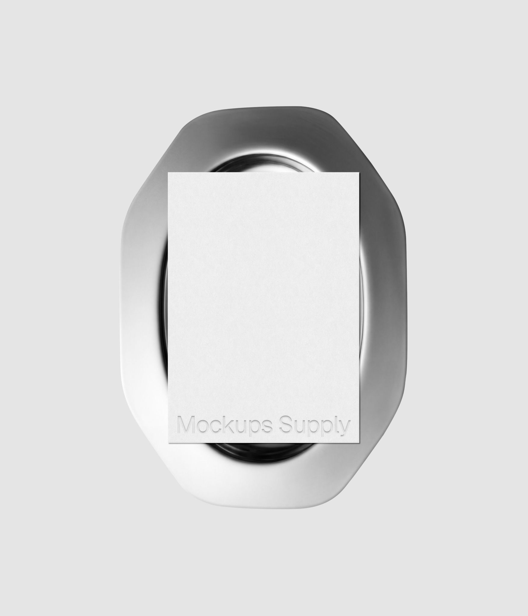 Paper mockup with embossed logo detail on sleek metal plate for identity design and portfolio showcase