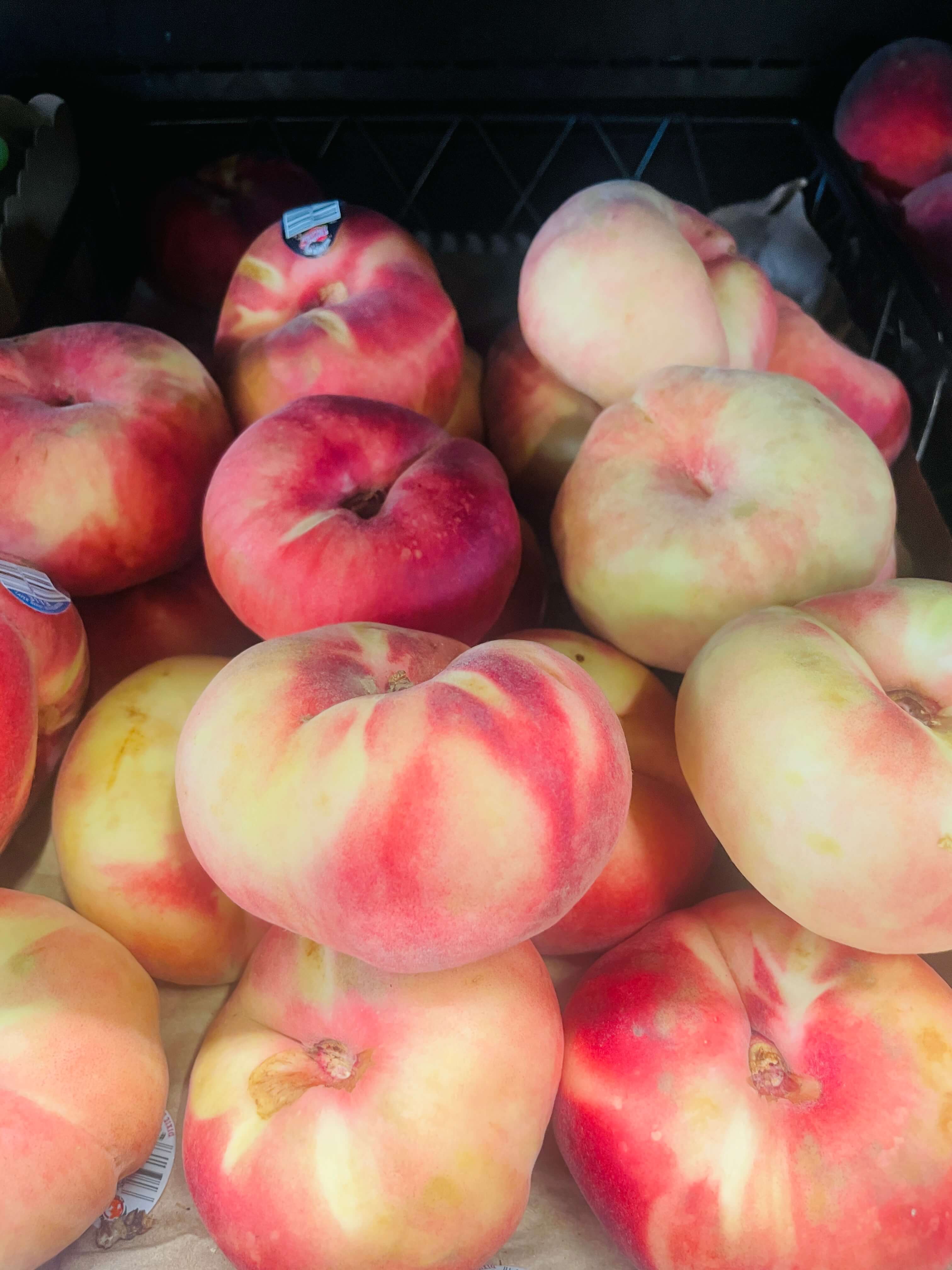 White peaches on display at International Food Market Orlando.