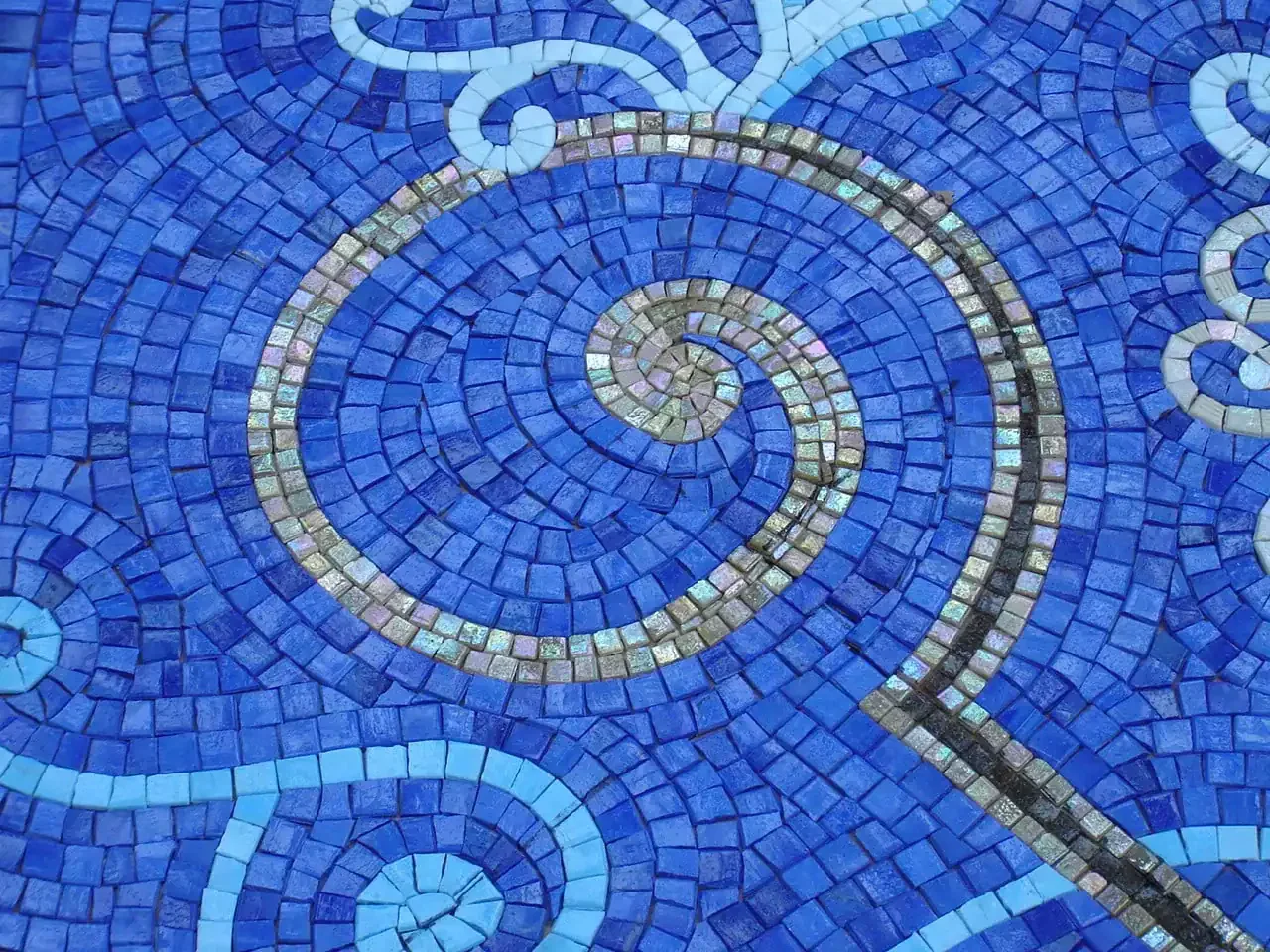 Close detail of the blue glass mosaic, individual tesserae visible — Mosaiclegs Art Studio