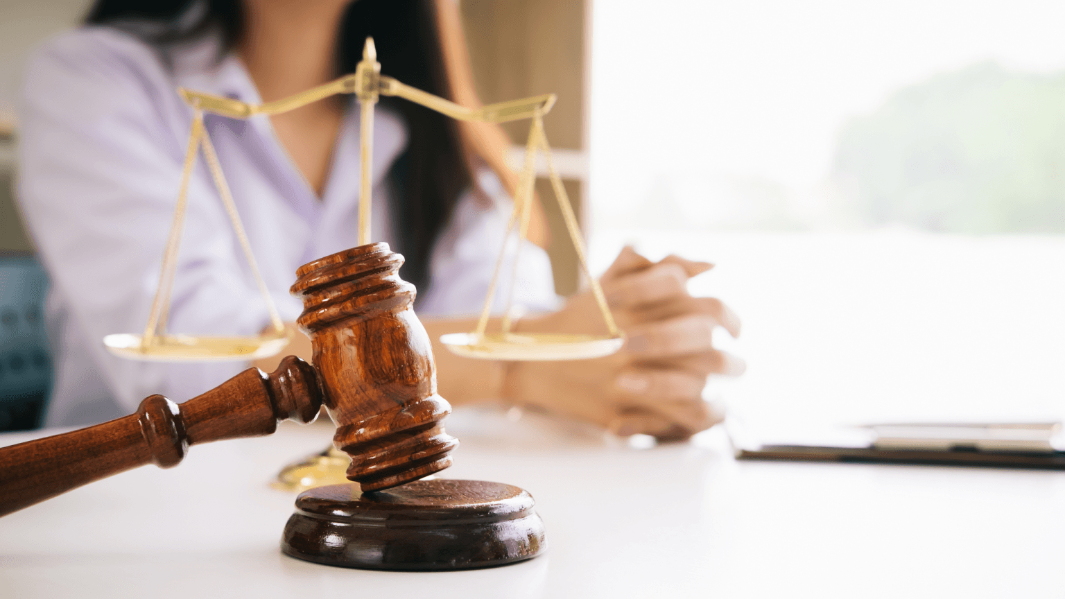 A compassionate immigration lawyer from Fibi Law Firm discussing paperwork with a hopeful client, symbolizing the expertise, guidance, and supportive nature of professional immigration legal assistance.