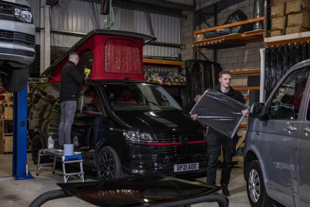Professional Cosmic Campervan employees installing Pop Tops on campervans