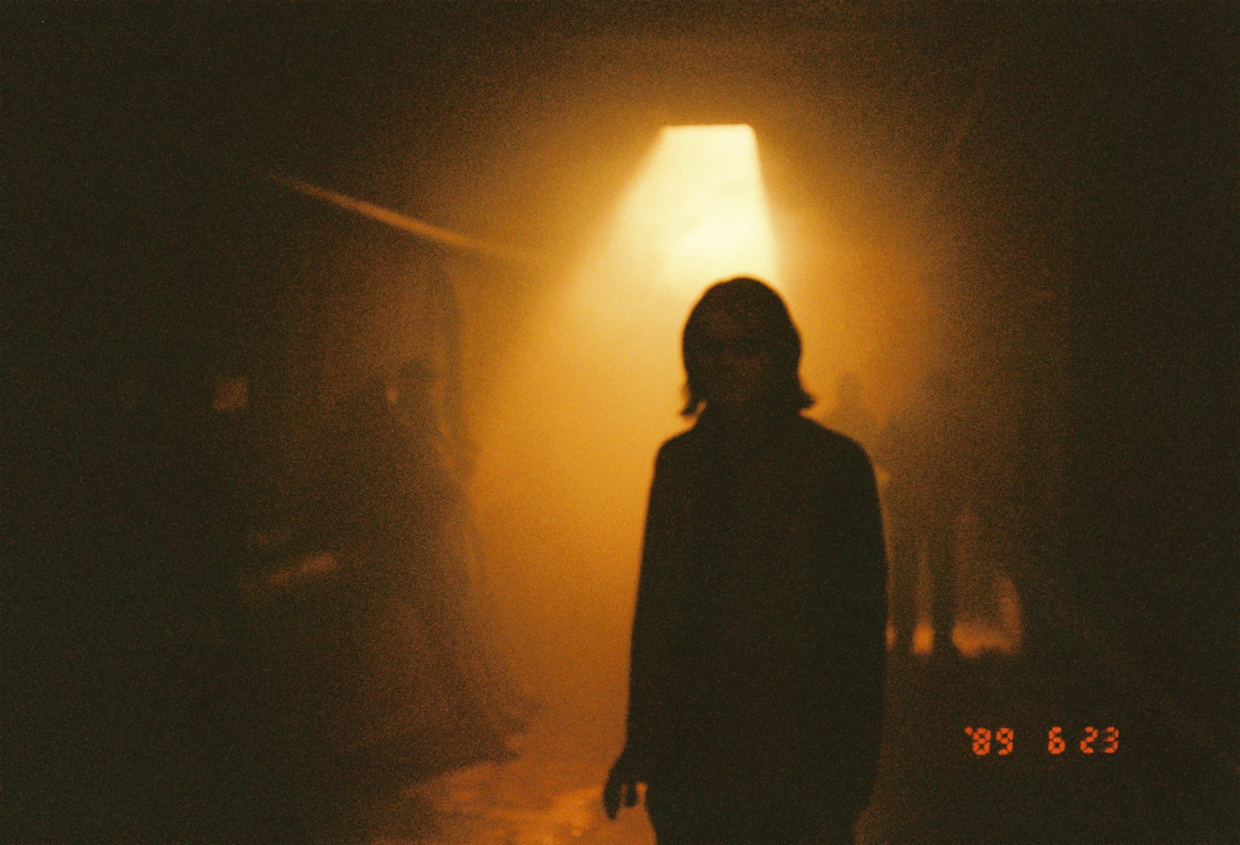 Kimchii music video, a silhouette in warm backlight