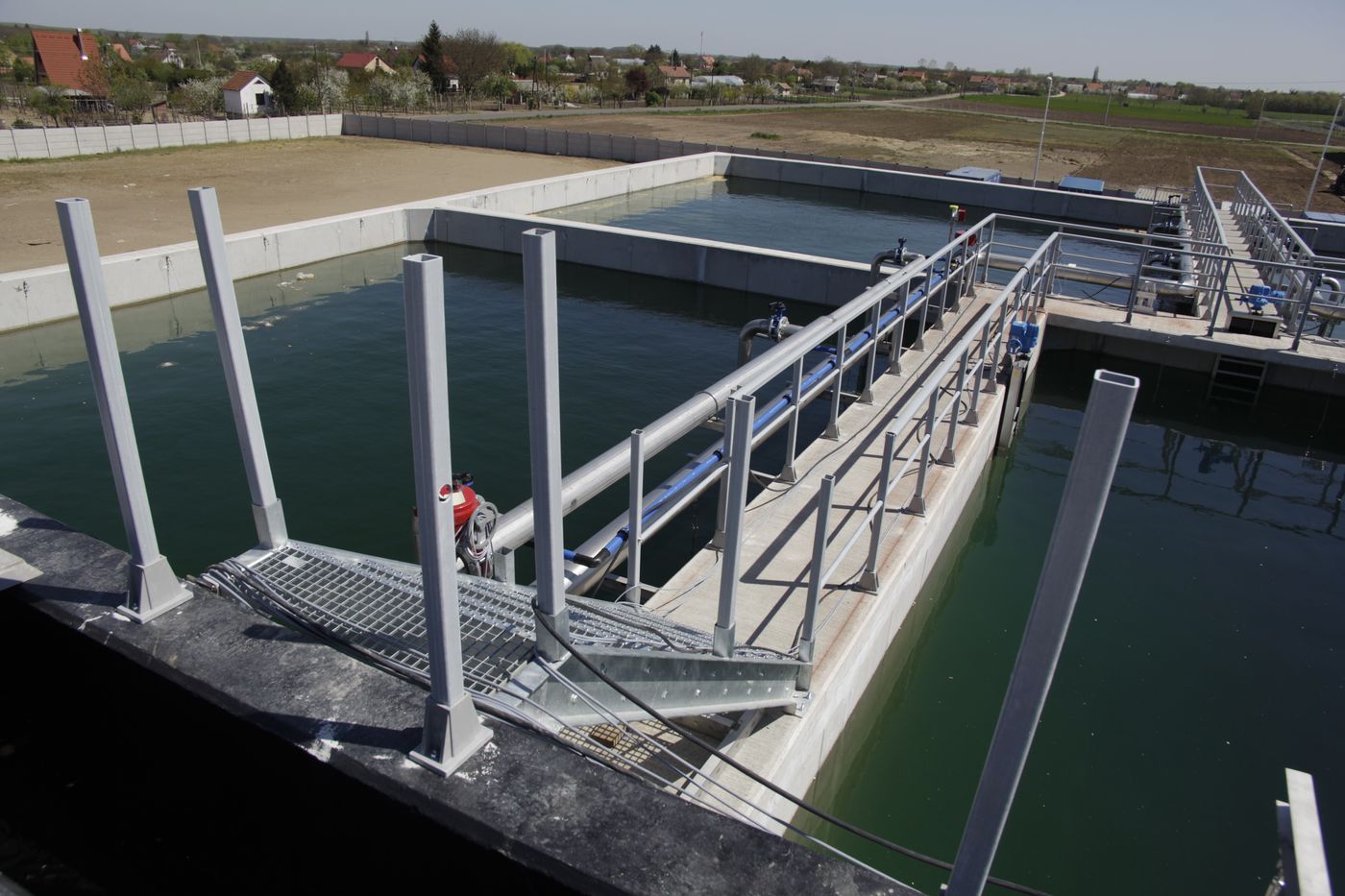 Access walkway and basins at the Bonduelle wastewater treatment plant, Nagykőrös, Hungary