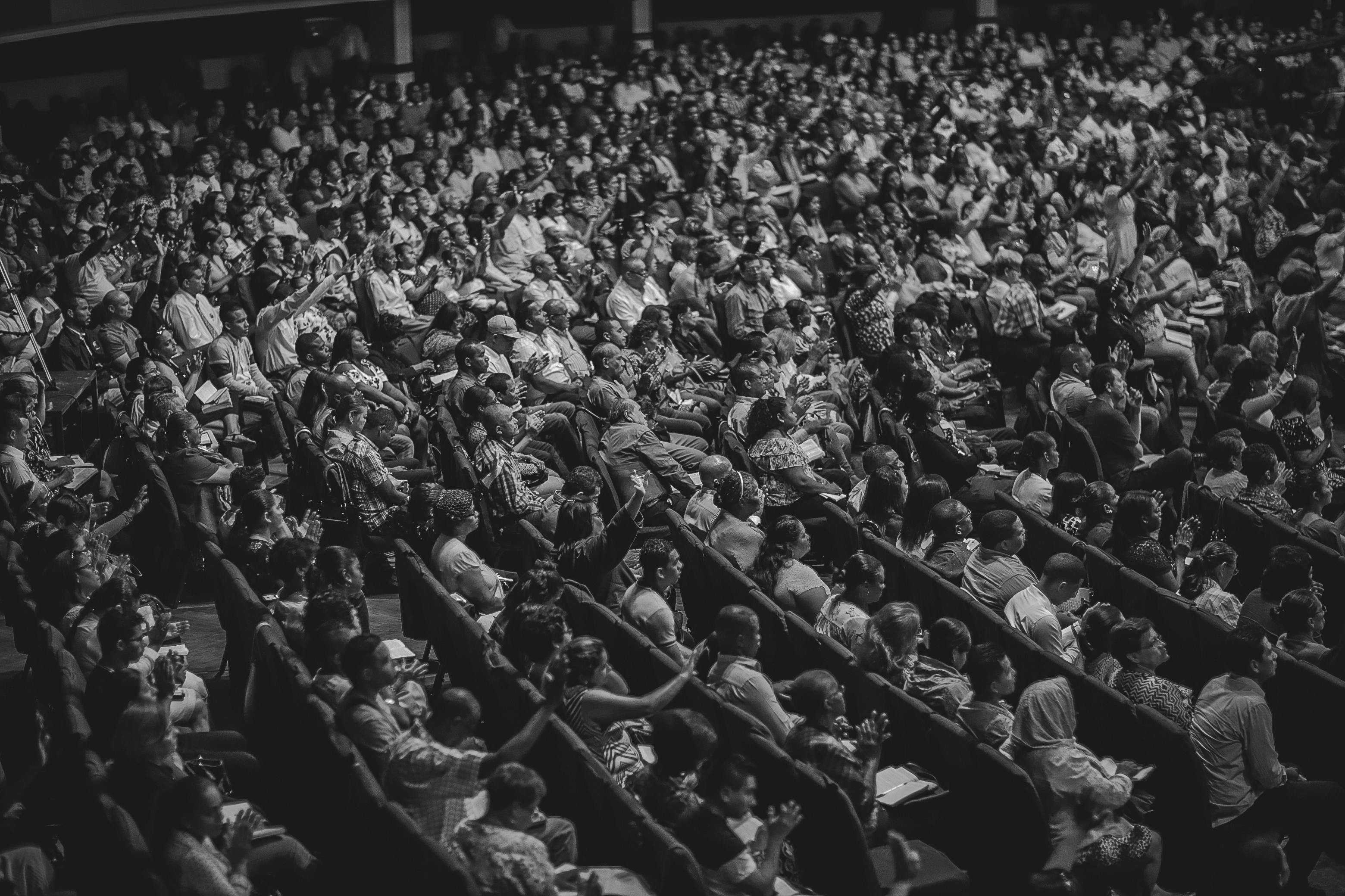 Speaker Presenting at Conference with Audience