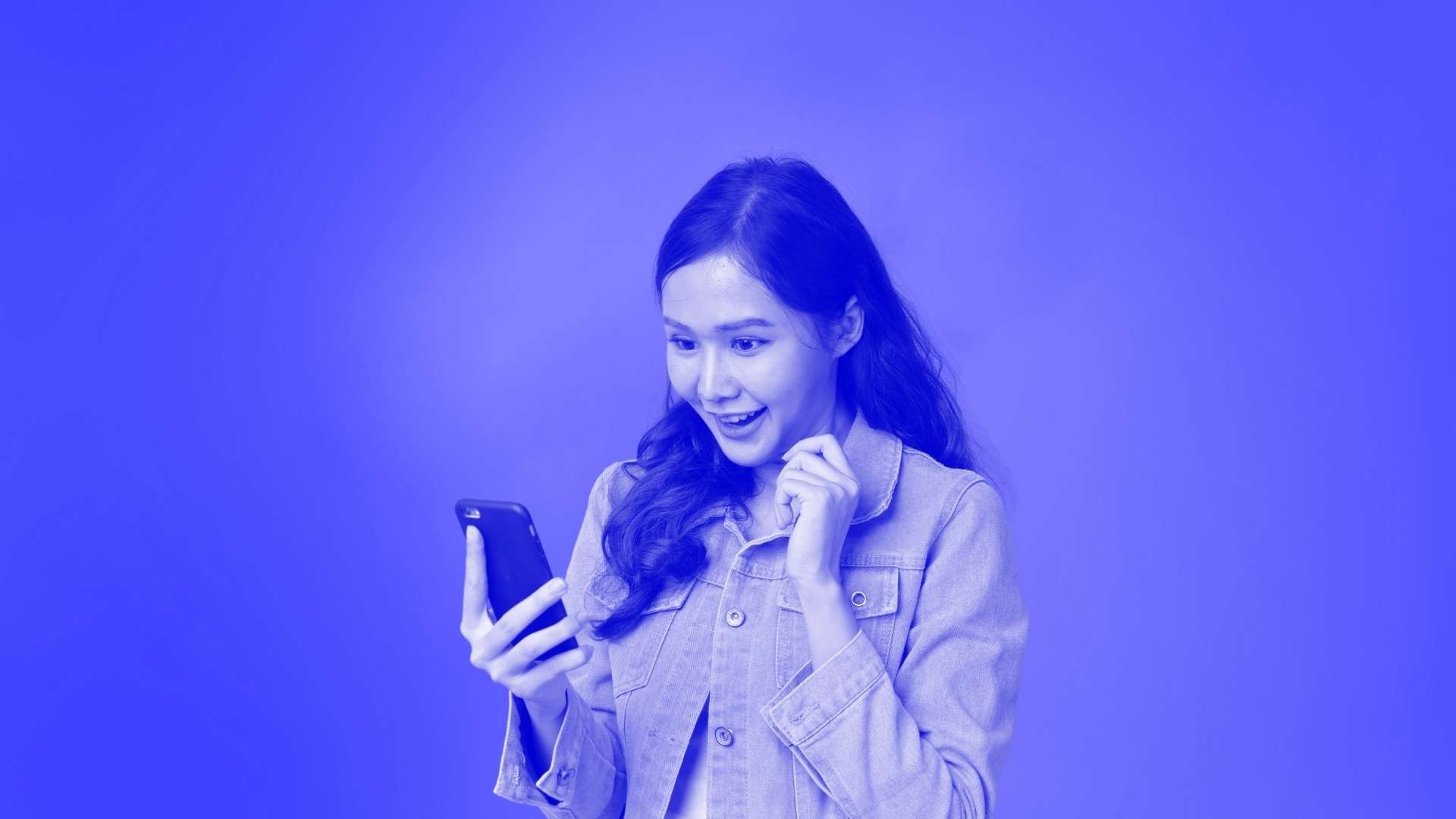 A woman staring at her mobile phone