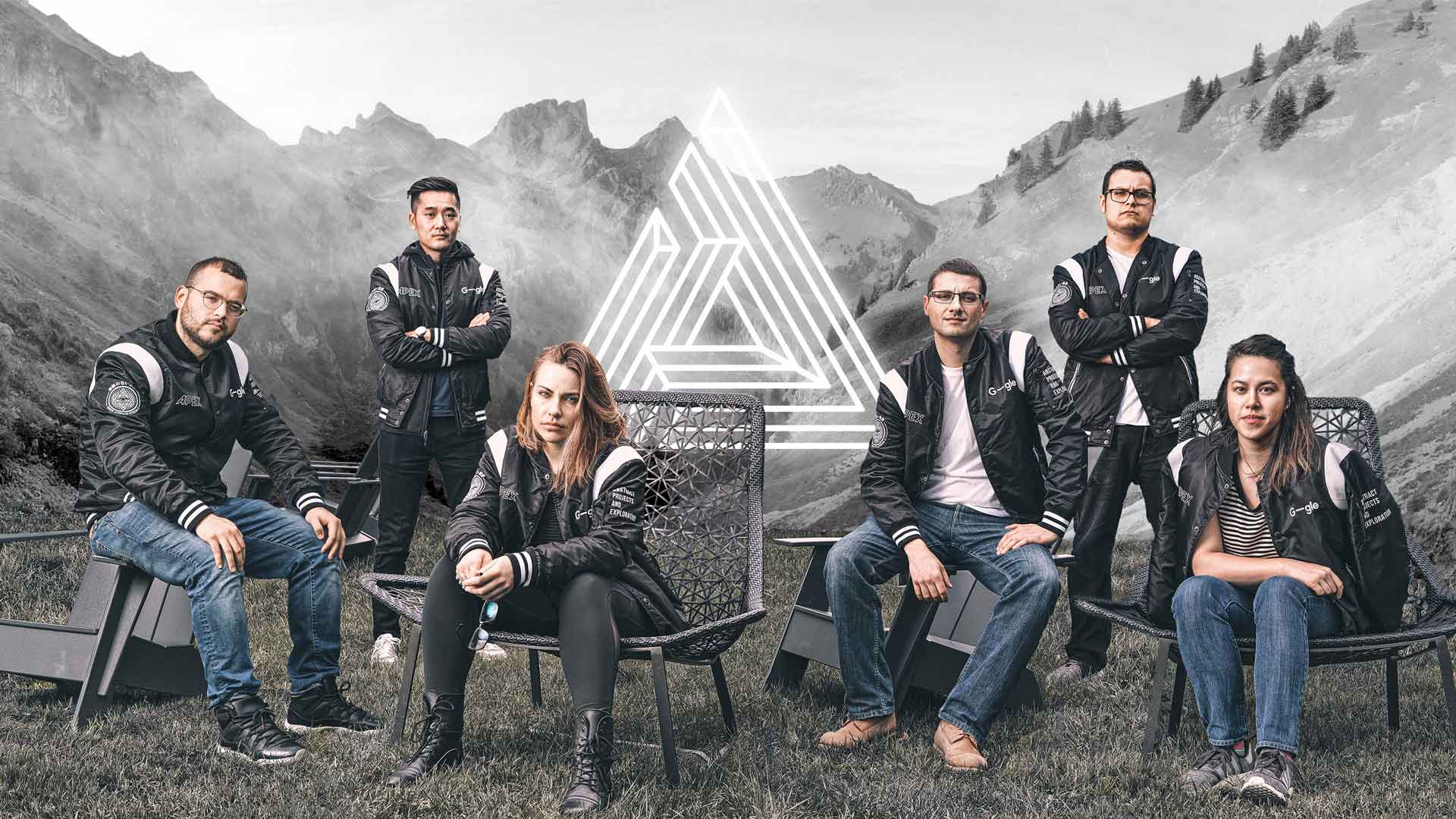 6 men and women in black jackets outdoors in front of a mountain
