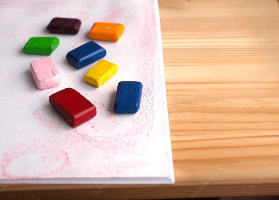 Close-up of lush, dark green leaves, some glossy and wet, against a muted background.