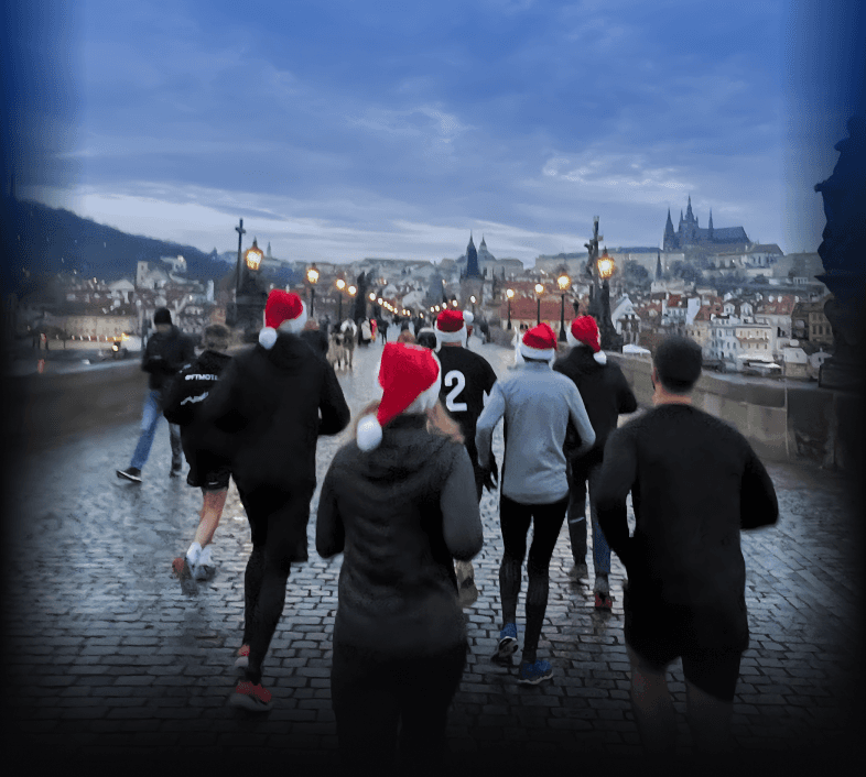 Group of people running on Charles Bridge