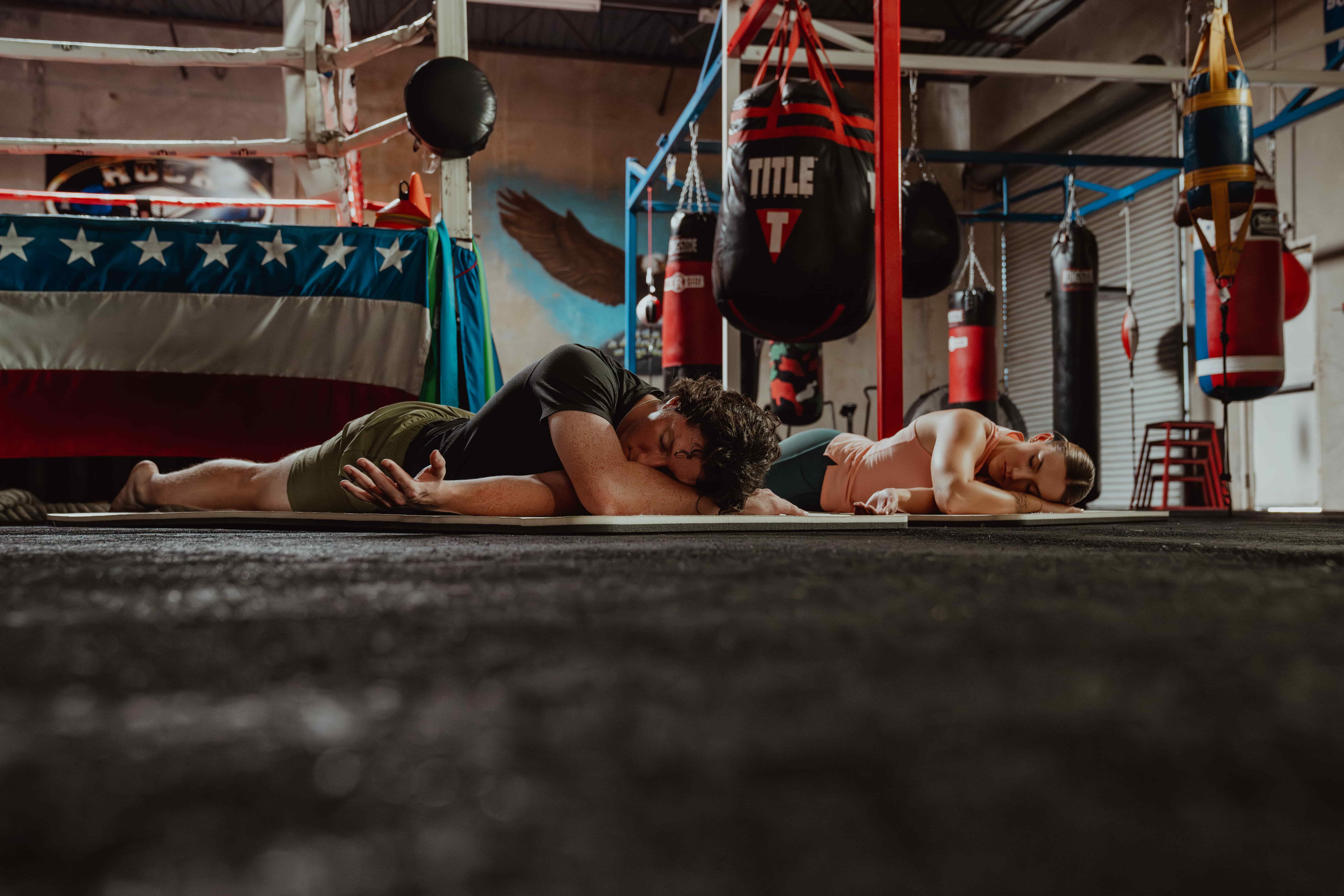 Man and Woman Stretching in Gym - Wrist Mobility Exercises