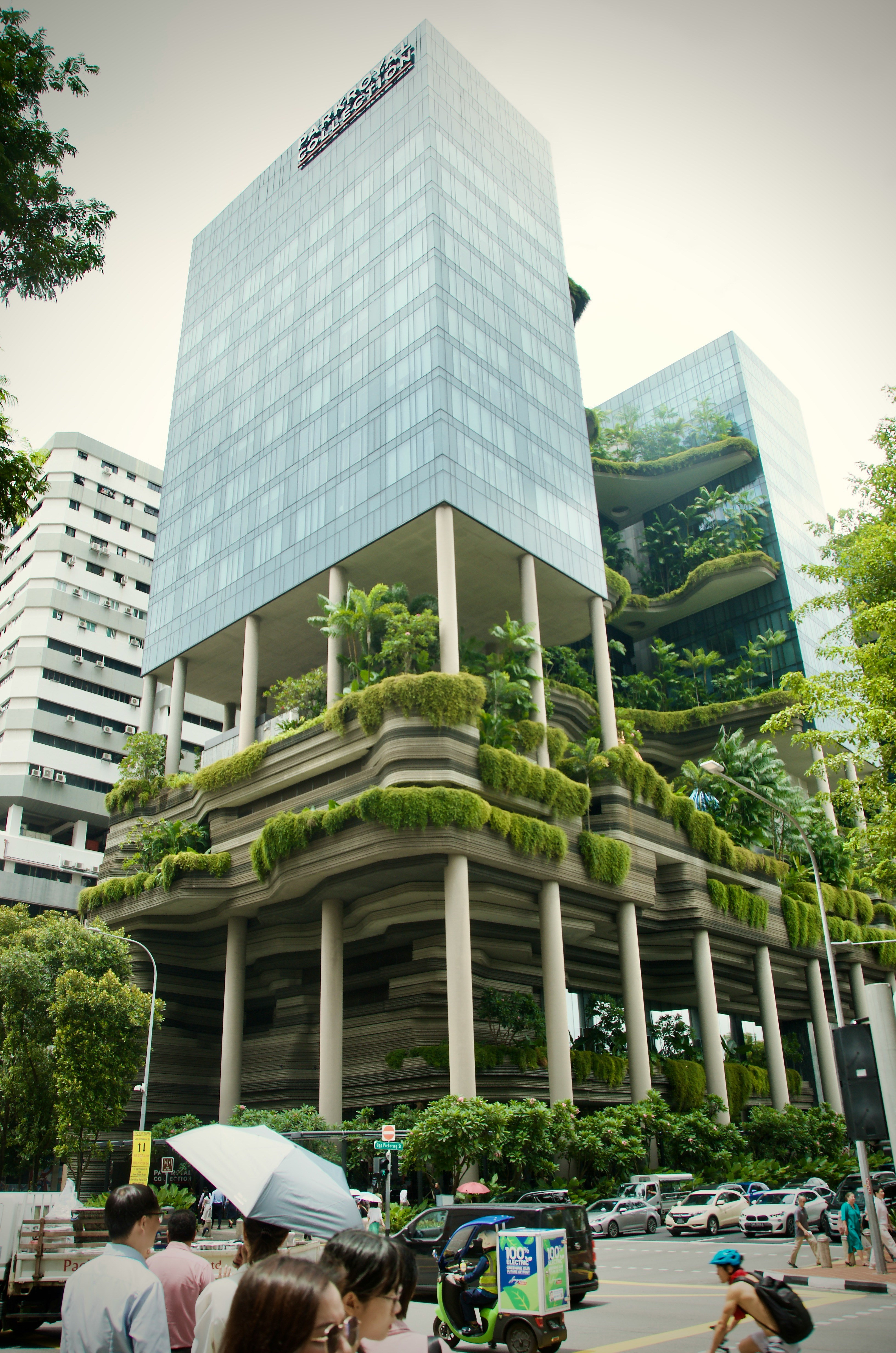 A group of people standing in front of a tall building