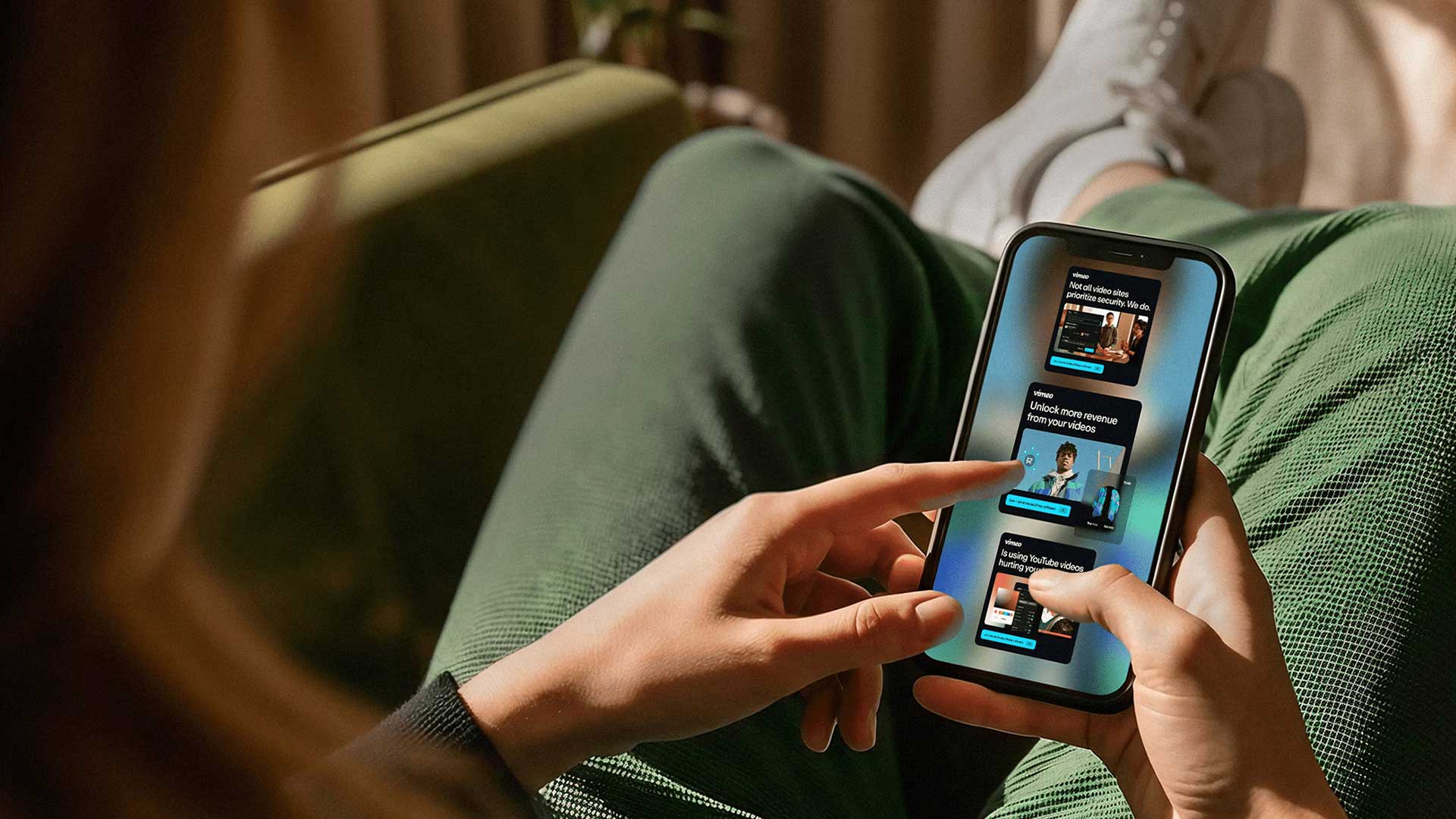 Person scrolling social media content on smartphone, representing scalable content production and campaign control