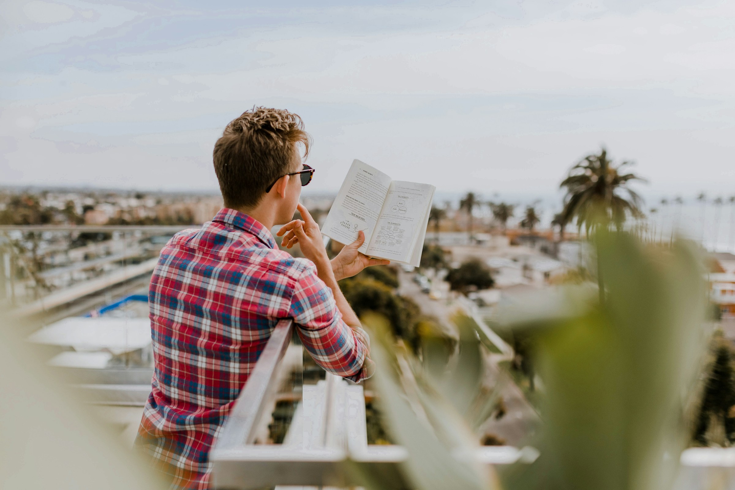 man reading a book - Benefits of Not Ejaculating for 30 Days