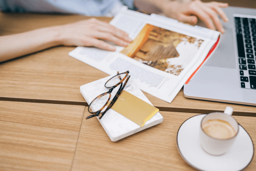 https://www.pexels.com/photo/eyeglasses-and-card-on-top-of-a-book-8938732/