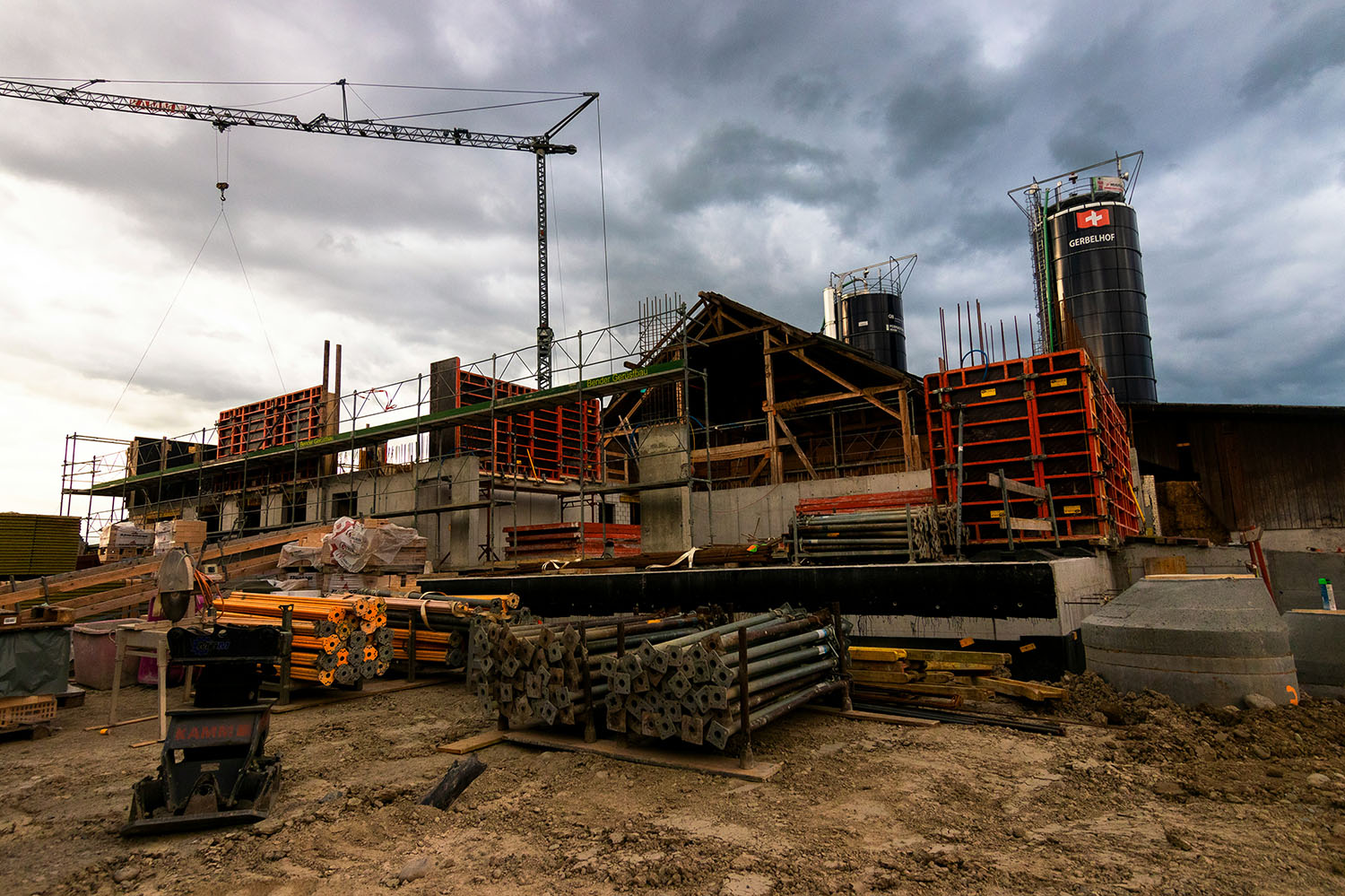 Construction site with building materials and framing, representing commercial project developmentpicture of a cyclist riding downhill