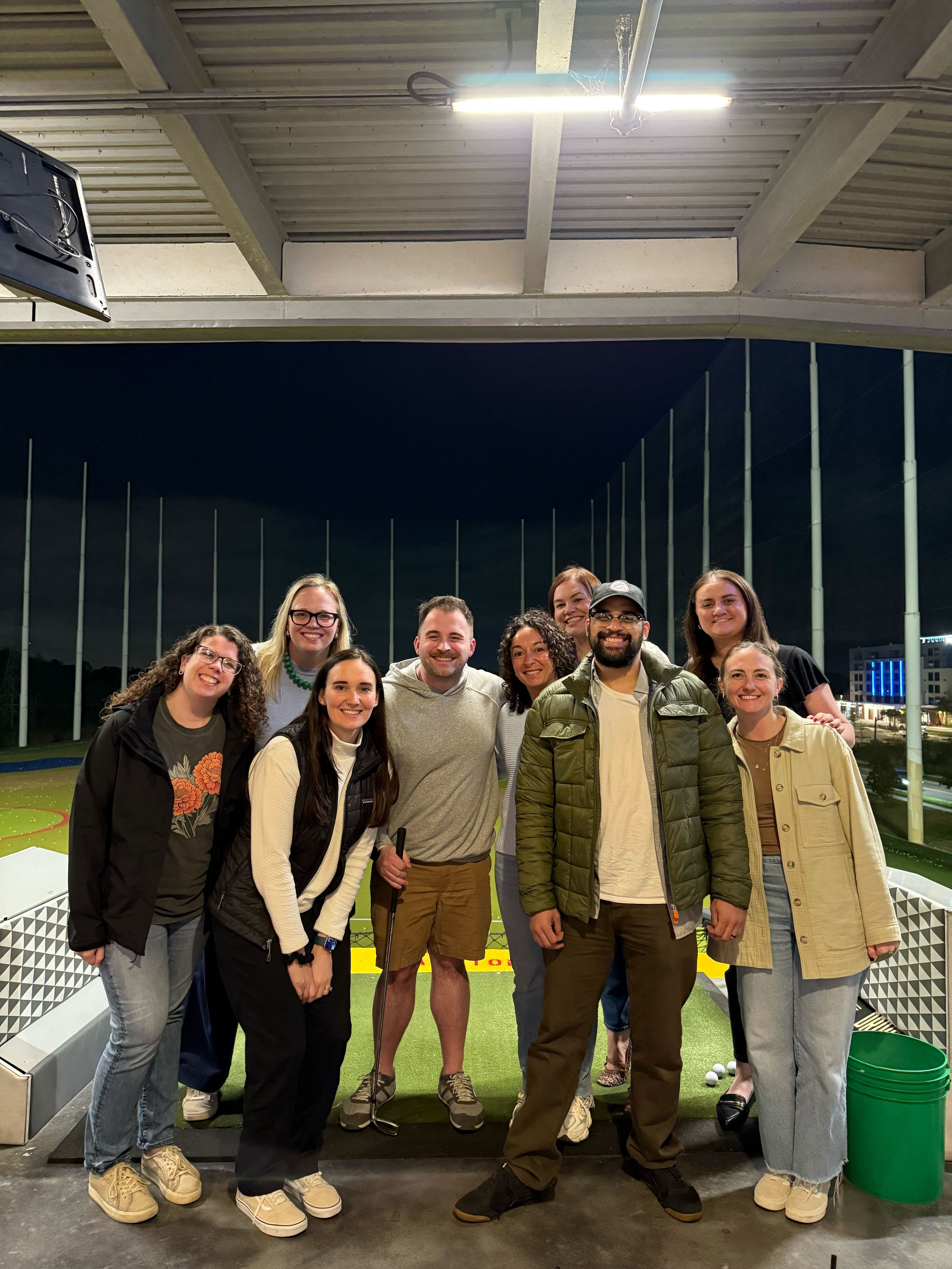 HealthJoy team at a group outing at a driving range.