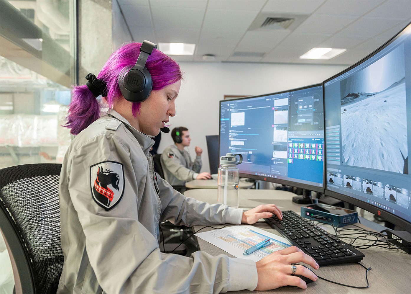 Carnegie mellon student in front of monitor showing moon surface