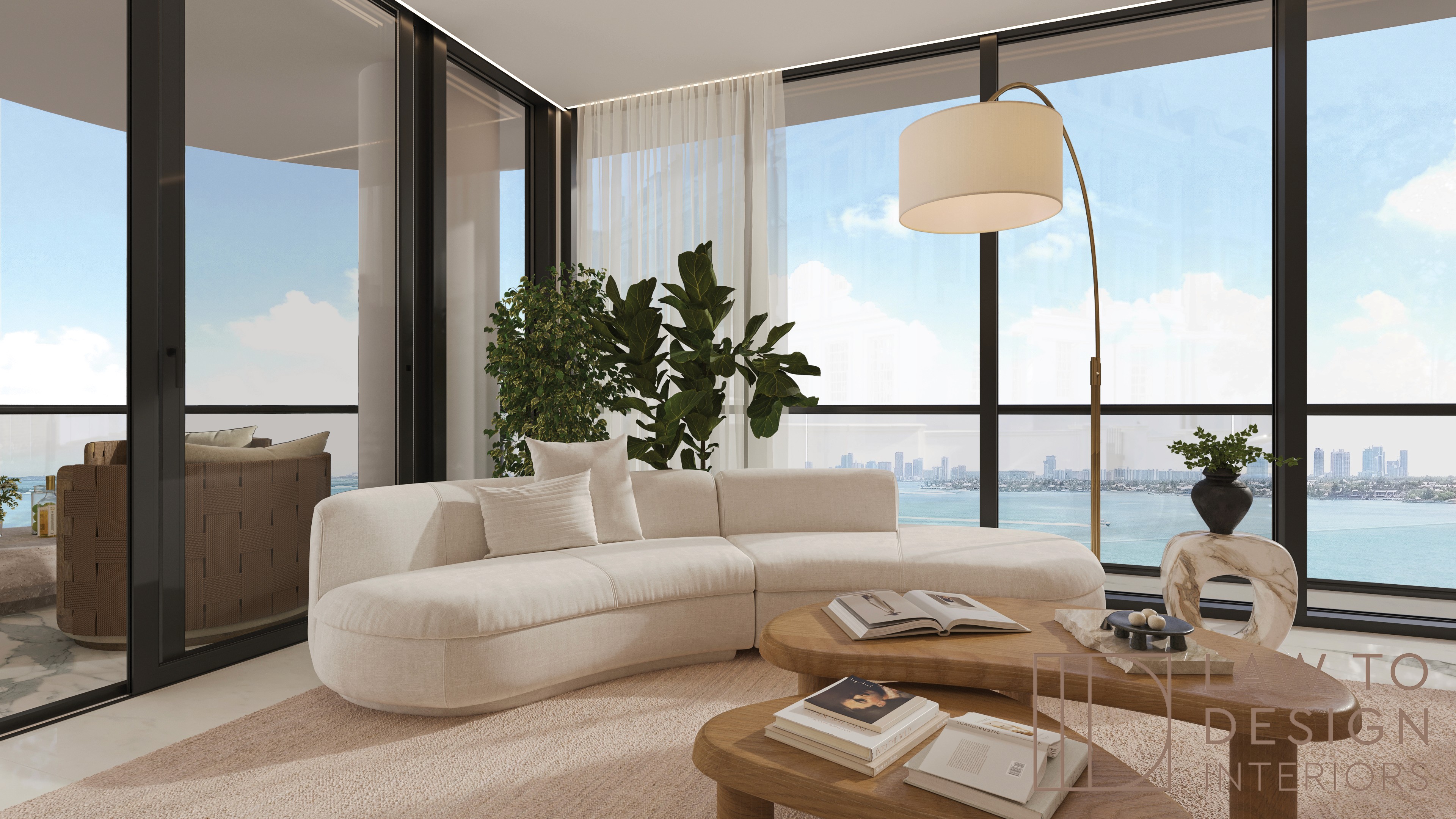 Aria Reserve Penthouse living room with bright waterfront view and refined furnishings