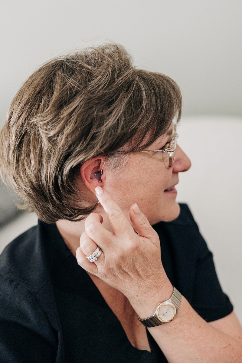 Dr Shannon Frymark wearing a hearing device