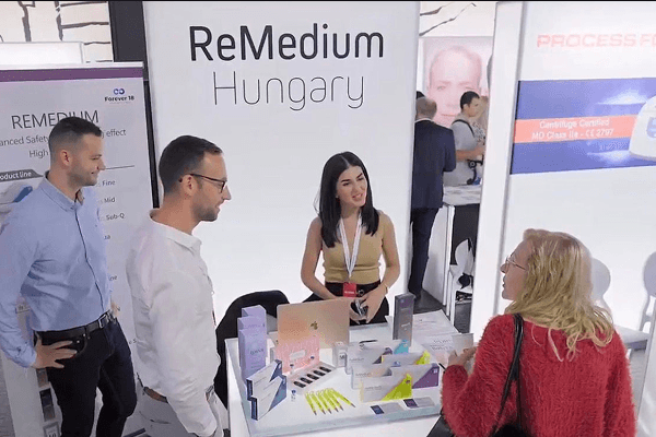 People browse art in a busy, modern gallery.